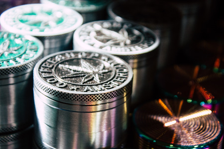 Closeup of decorative objects about cannabis sold in a traditional souvenirs shop at the Red Light district of Amsterdam in the morningの写真素材