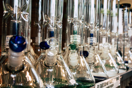 Amsterdam Netherlands April 10, 2019 Closeup of decoratives objects about cannabis sold in a traditional souvenirs shop at the Red Light district of Amsterdam in the morningのeditorial素材