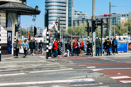 Amsterdam Netherlands April 10, 2019 View of the streets of Amsterdam in the old district near Central station in the eveningのeditorial素材