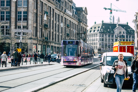 Amsterdam Netherlands April 10, 2019 View of traditional tramway in the streets of Amsterdam in the afternoonのeditorial素材