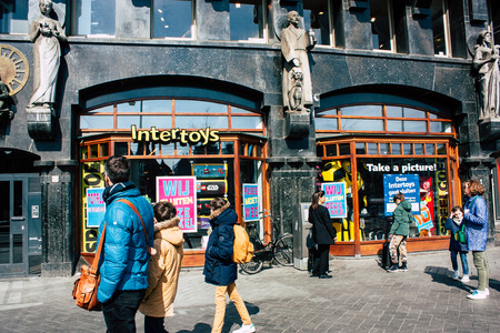 Amsterdam Netherlands April 10, 2019 View of the streets of Amsterdam in the old district near Central station in the eveningのeditorial素材
