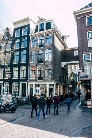 Amsterdam Netherlands April 10, 2019 View of the streets of Amsterdam in the old district near Central station in the eveningのeditorial素材