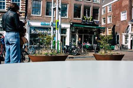Amsterdam Netherlands April 10, 2019 View of the streets of Amsterdam in the old district near Central station in the eveningのeditorial素材