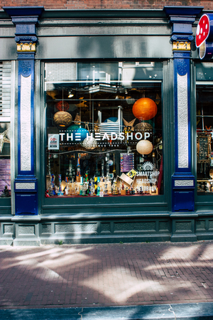 Amsterdam Netherlands April 10, 2019 View of a store located in the old district of Amsterdam near Central station in the eveningのeditorial素材