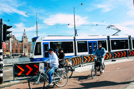Amsterdam Netherlands April 10, 2019 View of traditional tramway in the streets of Amsterdam in the afternoonのeditorial素材