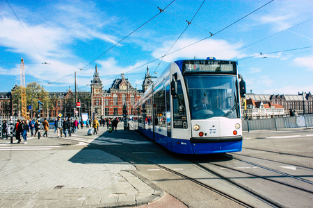 Amsterdam Netherlands April 10, 2019 View of traditional tramway in the streets of Amsterdam in the afternoonのeditorial素材