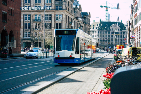 Amsterdam Netherlands April 10, 2019 View of traditional tramway in the streets of Amsterdam in the afternoonのeditorial素材