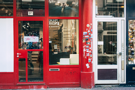Amsterdam Netherlands April 10, 2019 View of a store located in Nieuwe Hoogstraat street in Amsterdam in the eveningのeditorial素材
