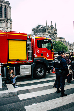 Paris France April 16, 2019 View of a fire truck parked near the Notre Dame cathedral in Paris the day after the big fire in the afternoonのeditorial素材