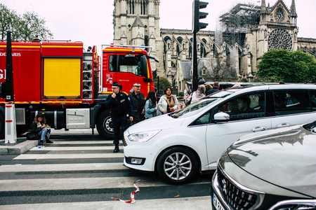 Paris France April 16, 2019 View of a fire truck parked near the Notre Dame cathedral in Paris the day after the big fire in the afternoonのeditorial素材