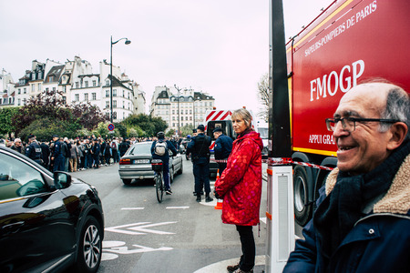 Paris France April 16, 2019 View of a fire truck parked near the Notre Dame cathedral in Paris the day after the big fire in the afternoonのeditorial素材