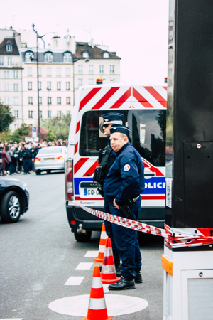Paris France April 16, 2019  View of police officers who secure the street front the Notre Dame cathedral which burned the day before in a big fire in the afternoonのeditorial素材
