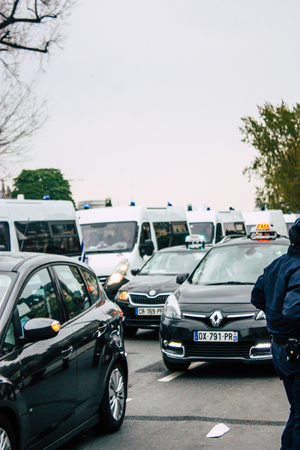 Paris France April 16, 2019 View of a French police car parked near the Notre Dame cathedral in Paris the day after the big fire in the afternoonのeditorial素材