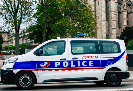Paris France April 16, 2019 View of a French police car parked near the Notre Dame cathedral in Paris the day after the big fire in the afternoonのeditorial素材