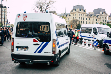 Paris France April 16, 2019 View of a French police car near the Notre Dame cathedral in Paris the day after the big fire in the afternoonのeditorial素材