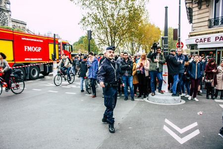 Paris France April 16, 2019  View of police officers who secure the street front the Notre Dame cathedral which burned the day before in a big fire in the afternoonのeditorial素材