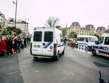 Paris France April 16, 2019 View of a French police car near the Notre Dame cathedral in Paris the day after the big fire in the afternoonのeditorial素材
