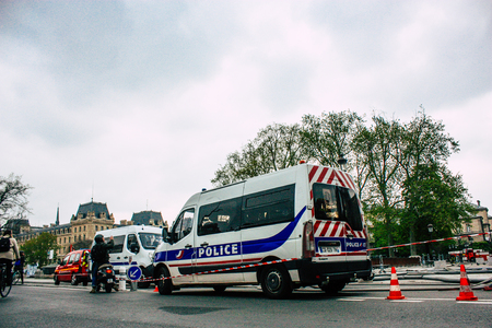 Paris France April 16, 2019 View of a French police car parked near the Notre Dame cathedral in Paris the day after the big fire in the afternoonのeditorial素材