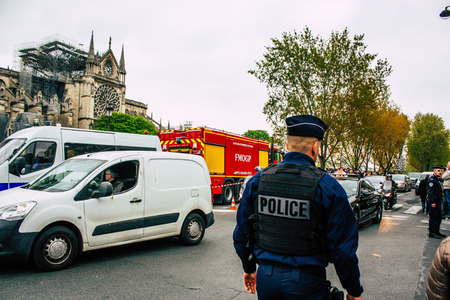 Paris France April 16, 2019  View of police officers who secure the street front the Notre Dame...