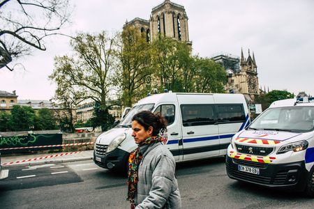 Paris France April 16, 2019 View of a French police car near the Notre Dame cathedral in Paris the day after the big fire in the afternoonのeditorial素材