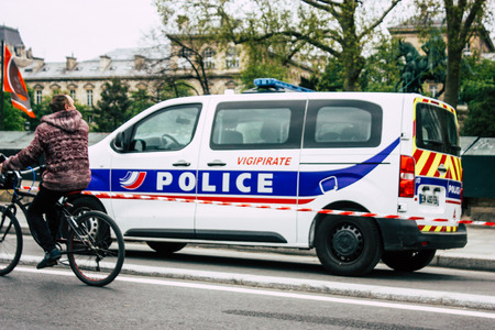Paris France April 16, 2019 View of a French police car parked near the Notre Dame cathedral in Paris the day after the big fire in the afternoonのeditorial素材