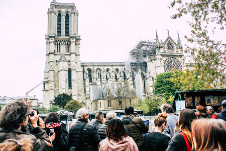 Paris France April 16, 2019  View of Parisians and tourists come to see the Notre Dame cathedral which burned the day before in a big fireのeditorial素材