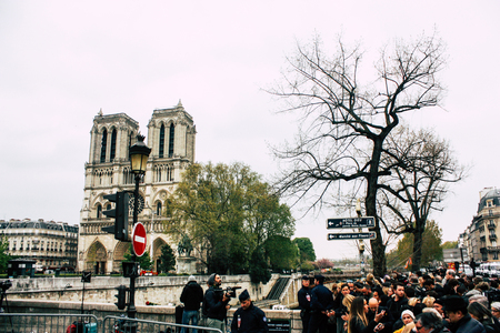 Paris France April 16, 2019  View of Parisians and tourists come to see the Notre Dame cathedral which burned the day before in a big fireのeditorial素材