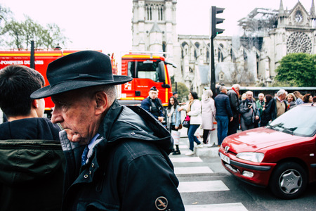 Paris France April 16, 2019  View of Parisians and tourists come to see the Notre Dame cathedral which burned the day before in a big fireのeditorial素材
