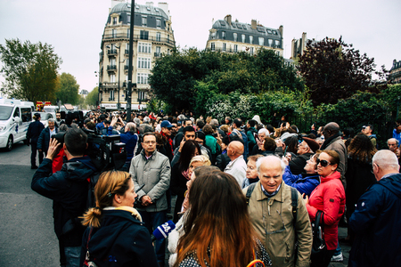 Paris France April 16, 2019  View of Parisians and tourists come to see the Notre Dame cathedral which burned the day before in a big fireのeditorial素材
