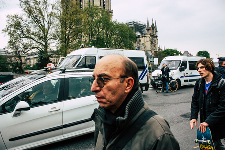 Paris France April 16, 2019  View of Parisians and tourists come to see the Notre Dame cathedral which burned the day before in a big fireのeditorial素材