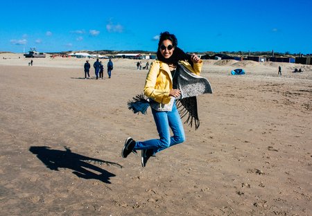 Scheveningen Netherlands March 22, 2019 Portrait of Reachel Singh, Dutch professional songwriter and singer having fun on the beach of Scheveningen near The Hague in Netherlands in the afternoonのeditorial素材