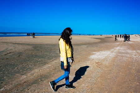 Scheveningen Netherlands March 22, 2019 Portrait of Reachel Singh, Dutch professional songwriter and singer having fun on the beach of Scheveningen near The Hague in Netherlands in the afternoonのeditorial素材