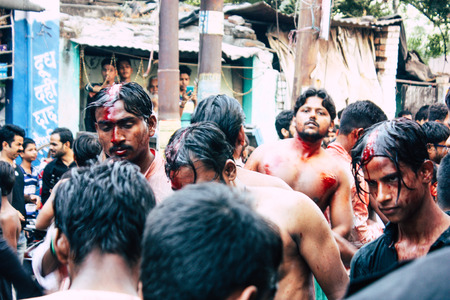 Varanasi India November 17, 2018 View of unknowns Shiite  Muslims use chains and blades during ritual self flagellation as part of the Imam Husain celebration, Ashura commemorations in the Arabian district of Varanasi in the morningのeditorial素材