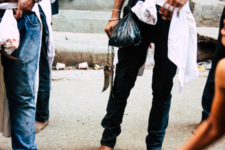 Varanasi India November 17, 2018 View of unknowns Shiite  Muslims use chains and blades during ritual self flagellation as part of the Imam Husain celebration, Ashura commemorations in the Arabian district of Varanasi in the morningのeditorial素材