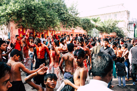 Varanasi India November 17, 2018 View of unknowns Shiite  Muslims use chains and blades during ritual self flagellation as part of the Imam Husain celebration, Ashura commemorations in the Arabian district of Varanasi in the morningのeditorial素材