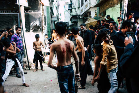 Varanasi India November 17, 2018 View of unknowns Shiite  Muslims use chains and blades during ritual self flagellation as part of the Imam Husain celebration, Ashura commemorations in the Arabian district of Varanasi in the morningのeditorial素材