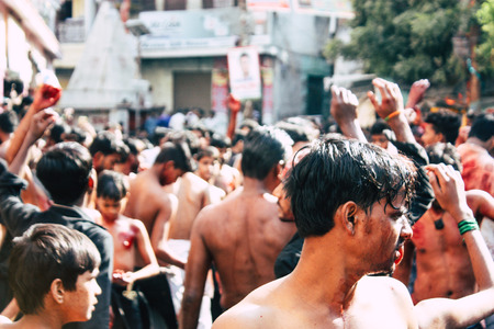 Varanasi India November 17, 2018 View of unknowns Shiite  Muslims use chains and blades during ritual self flagellation as part of the Imam Husain celebration, Ashura commemorations in the Arabian district of Varanasi in the morningのeditorial素材
