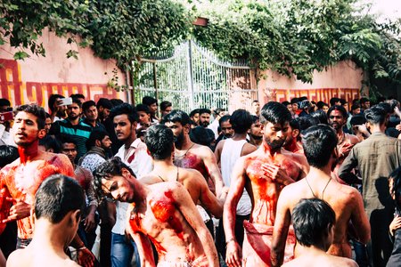 Varanasi India November 17, 2018 View of unknowns Shiite  Muslims use chains and blades during ritual self flagellation as part of the Imam Husain celebration, Ashura commemorations in the Arabian district of Varanasi in the morningのeditorial素材