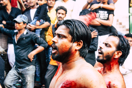Varanasi India November 17, 2018 View of unknowns Shiite  Muslims use chains and blades during ritual self flagellation as part of the Imam Husain celebration, Ashura commemorations in the Arabian district of Varanasi in the morningのeditorial素材