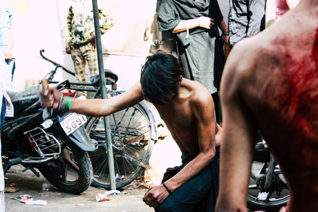 Varanasi India November 17, 2018 View of unknowns Shiite  Muslims use chains and blades during ritual self flagellation as part of the Imam Husain celebration, Ashura commemorations in the Arabian district of Varanasi in the morningのeditorial素材
