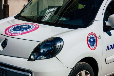 Reims France April 21, 2019 Closeup of a white police car of the penitentiary administration parked front the tribunal of Reims in the afternoonのeditorial素材