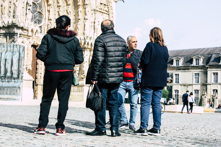 Reims France April 21, 2019 View of unknowns tourist walking on the forecourt of the Notre Dame de Reims Cathedral in the afternoonのeditorial素材