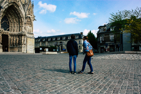Reims France April 21, 2019 View of unknowns tourist walking on the forecourt of the Notre Dame de Reims Cathedral in the afternoonのeditorial素材