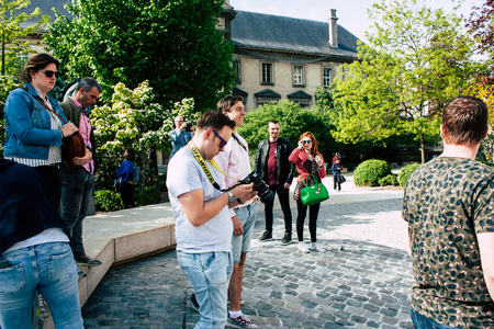 Reims France April 21, 2019 View of unknowns tourist walking on the forecourt of the Notre Dame de Reims Cathedral in the afternoonのeditorial素材