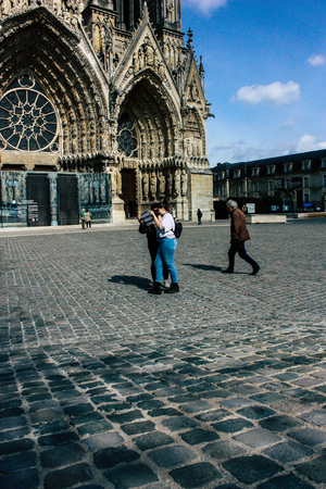 Reims France April 21, 2019 View of unknowns tourist walking on the forecourt of the Notre Dame de Reims Cathedral in the afternoonのeditorial素材