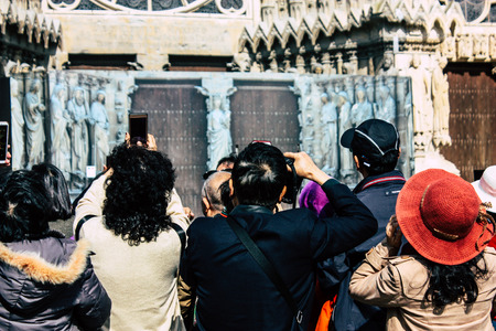 Reims France April 21, 2019 View of unknowns tourist walking on the forecourt of the Notre Dame de Reims Cathedral in the afternoonのeditorial素材