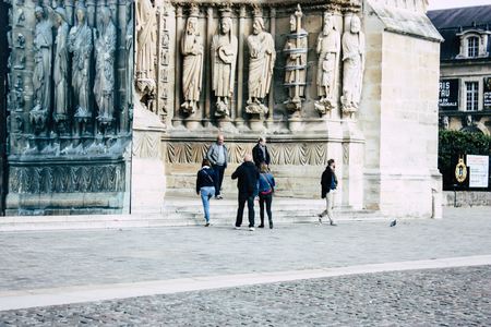 Reims France April 21, 2019 View of unknowns tourist walking on the forecourt of the Notre Dame de Reims Cathedral in the afternoonのeditorial素材