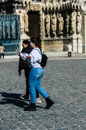Reims France April 21, 2019 View of unknowns tourist walking on the forecourt of the Notre Dame de Reims Cathedral in the afternoonのeditorial素材