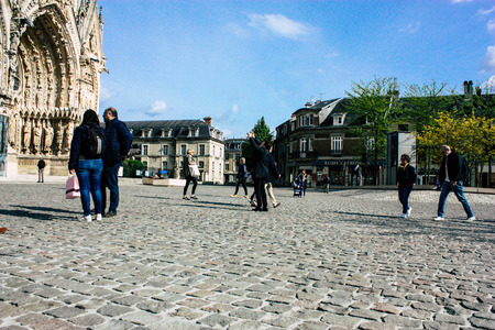 Reims France April 21, 2019 View of unknowns tourist walking on the forecourt of the Notre Dame de Reims Cathedral in the afternoonのeditorial素材