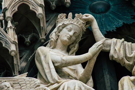 Reims France May 3, 2019 Closeup of the statues on the exterior facade of the Notre Dame de Reims cathedral in the morningの写真素材